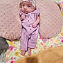 Susanna joined the competition — help win amazing prizes! baby, infant, headband, pillow, blanket, purple_clothing, footwear_none, indoor, cute, newborn, soft_texture, floral_pattern, sleeping_area, child, person, resting, pink, pastel_colors, cozy, portrait