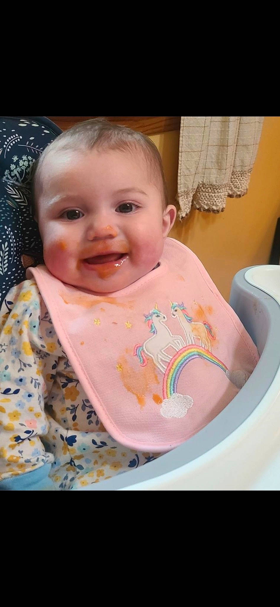 Athena is registered to the contest to win money with this photo: baby, baby_toddler_clothing, bib, cheek, chin, eye, eyebrow, face, happy, head, iris, joy, lip, mouth, nose, person, pink, product, skin, sleeve