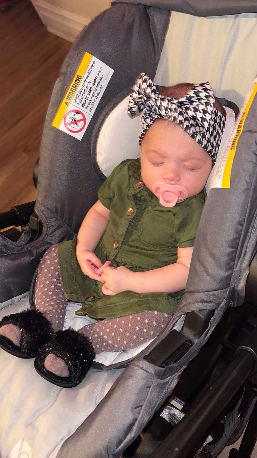 Lyrica joined the competition — help win amazing prizes! baby, sleeping, stroller, headband, green_dress, pacifier, polka_dot_tights, fuzzy_slippers, infant, child, indoor, seat, warning_label, hands, face, cute, peaceful, soft_lighting, wooden_floor, cozy