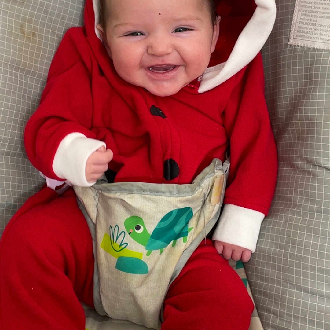 Hazlee joined the competition — help win amazing prizes! baby, baby_boy, baby_fashion, baby_seat, child, close_up, comfort, cute, footwear_free, happy, hooded_onesie, indoor, infant, infant_clothing, patterned_cushion, red_clothing, seated, smiling, toothy_grin, turtle_design