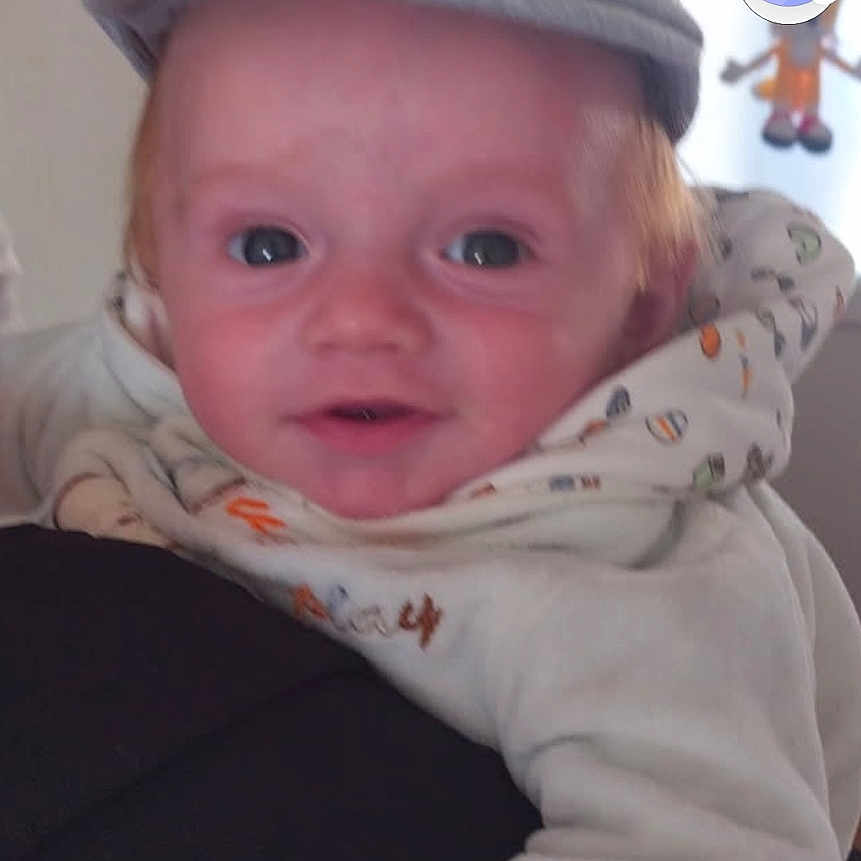 Luciano a rejoint le concours — aidez-le/la à gagner de superbes lots ! baby, casual, child, clothing, cozy, cute, face, happy, hat, headwear, holding, hoodie, indoor, infant, light, person, portrait, skin, smiling, young