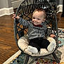 Asher joined the competition — help win amazing prizes! baby, child, indoor, chair, wicker_chair, checkered_shirt, bow_tie, smile, pointing, cushion, rug, wooden_floor, person, cute, playful, cozy, furniture, toddler, happy, home
