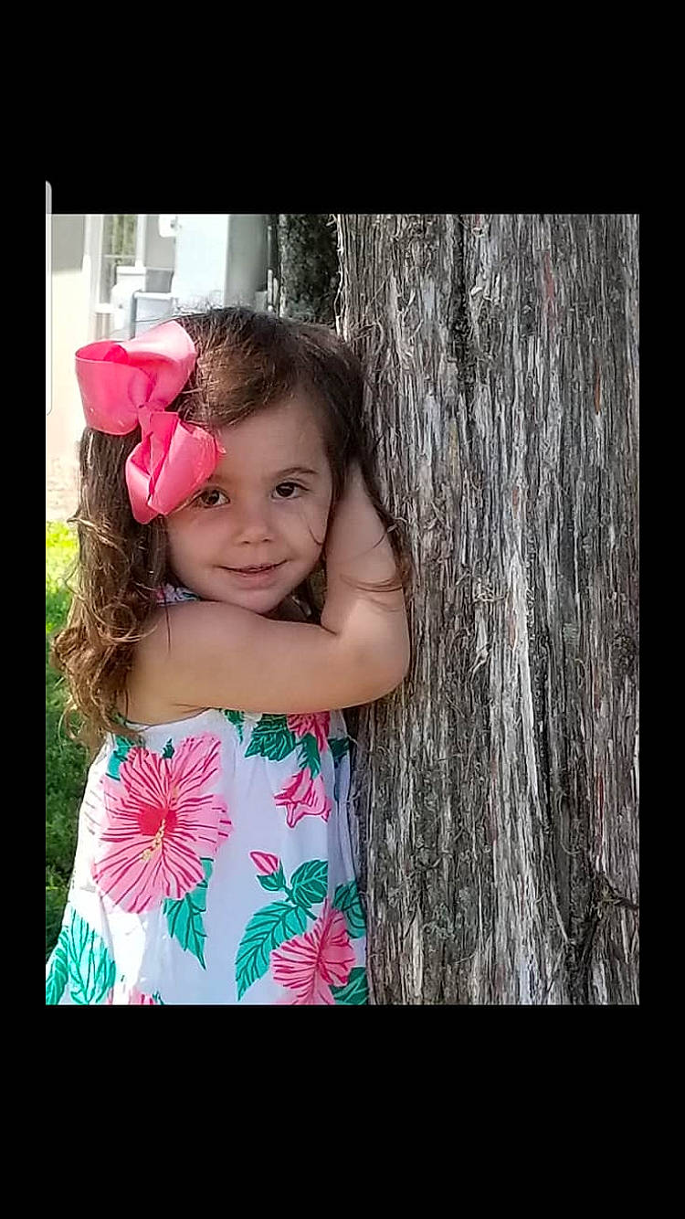 Payton is registered to the contest to win money with this photo: beauty, cheek, child, child_model, cool, eye, face, facial_expression, happy, head, joy, nose, person, photograph, photography, pink, plant, skin, smile, snapshot