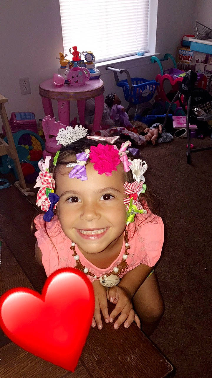 Payton joined the competition — help win amazing prizes! child, fashion_accessory, hair_accessory, headband, headgear, headpiece, joy, party, party_supply, person, pink, smile, tiara, toddler