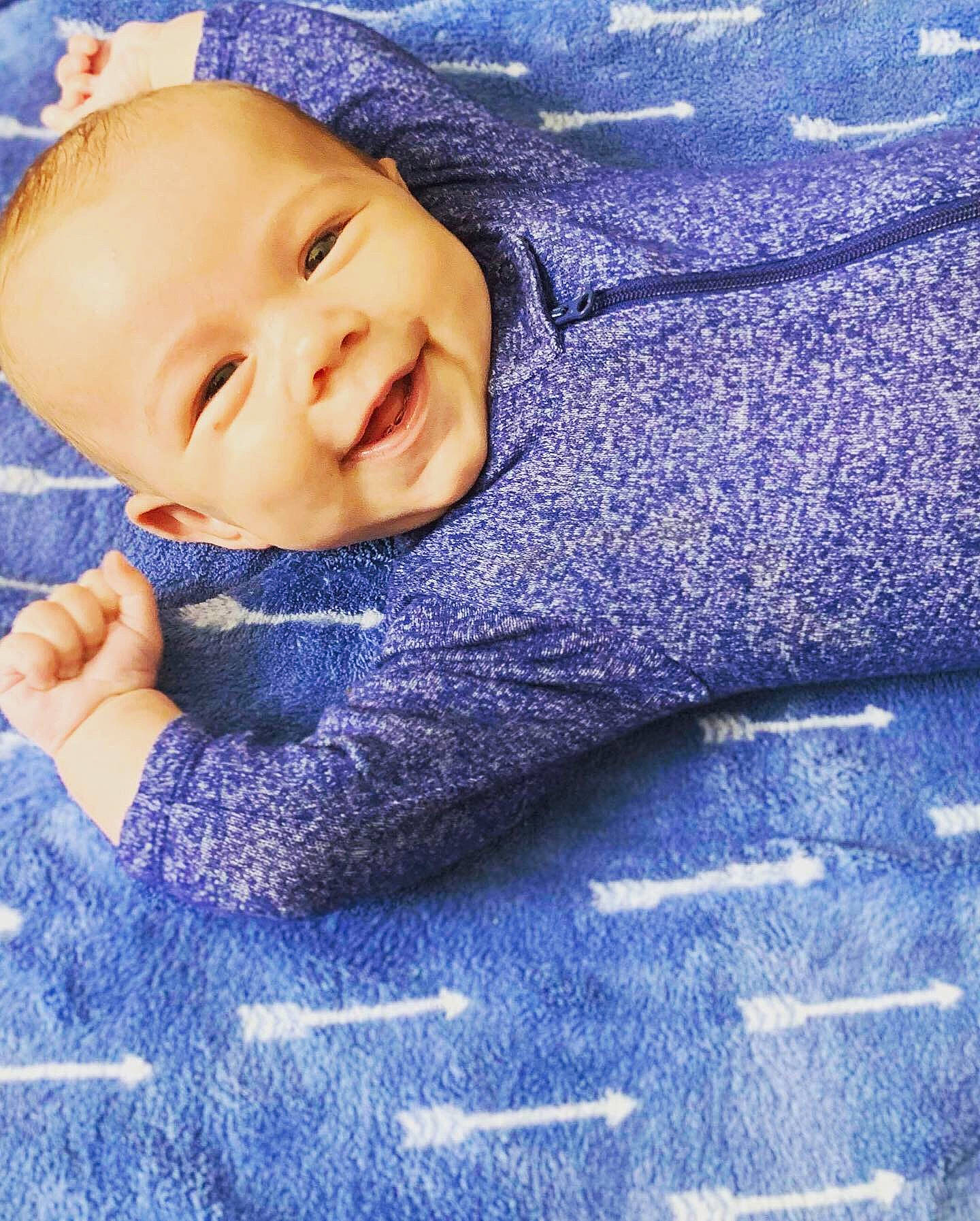 Rowan joined the competition — help win amazing prizes! baby, blanket, blue, cheek, child, happy, joy, nose, person, purple, skin, sleep, smile, textile, toddler