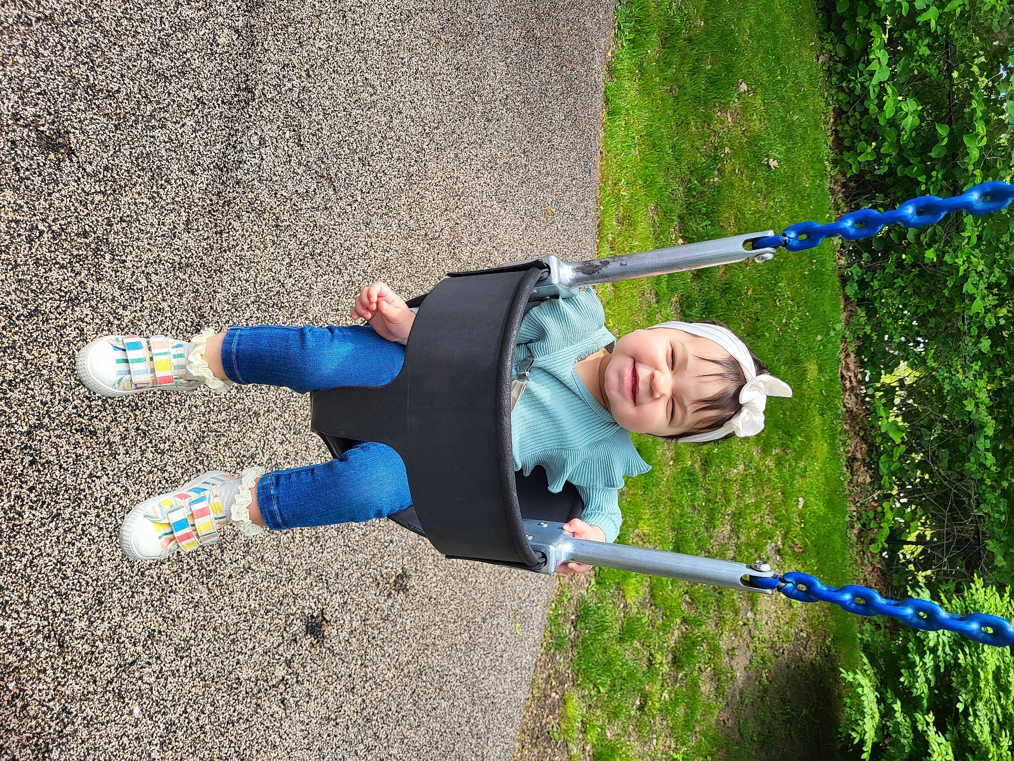 Alanna is registered to the contest to win money with this photo: asphalt, balance, child, electric_blue, fun, grass, headwear, human_leg, leisure, outdoor_play_equipment, people_in_nature, person, play, recreation, rope, smile, sneakers, sports, tar, toddler