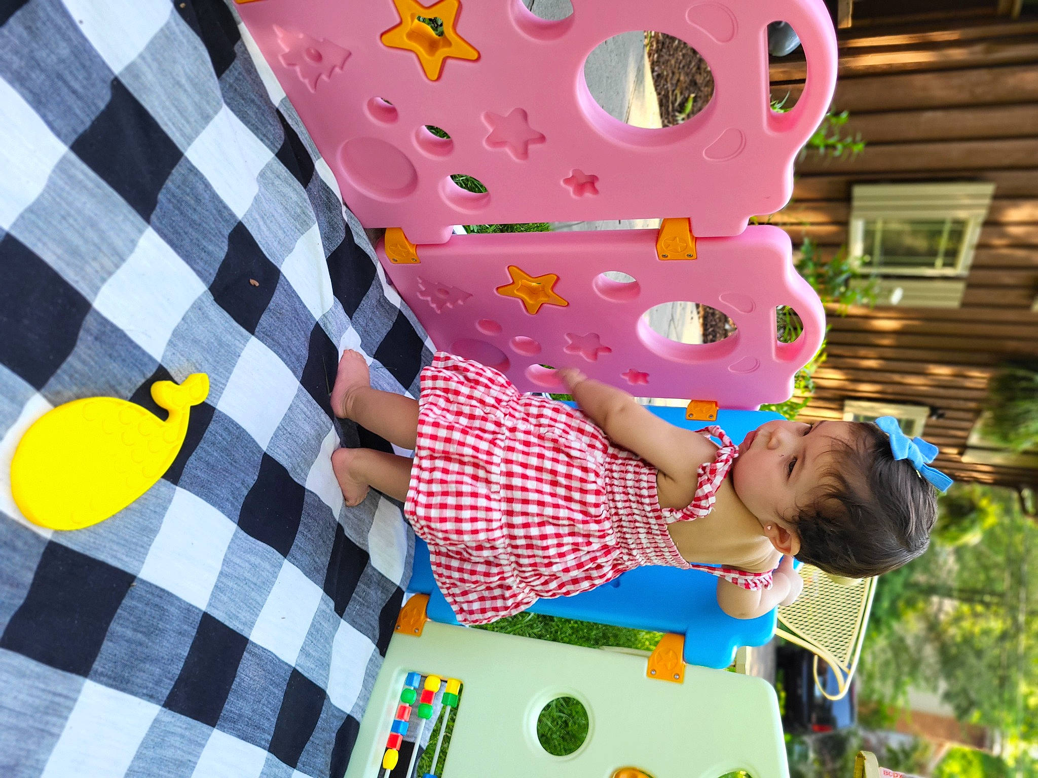 Alanna is registered to the contest to win money with this photo: baby_toddler_clothing, child, circle, design, fun, green, happy, leisure, linens, magenta, party_supply, pattern, person, pink, plaid, play, tartan, textile, toddler, window