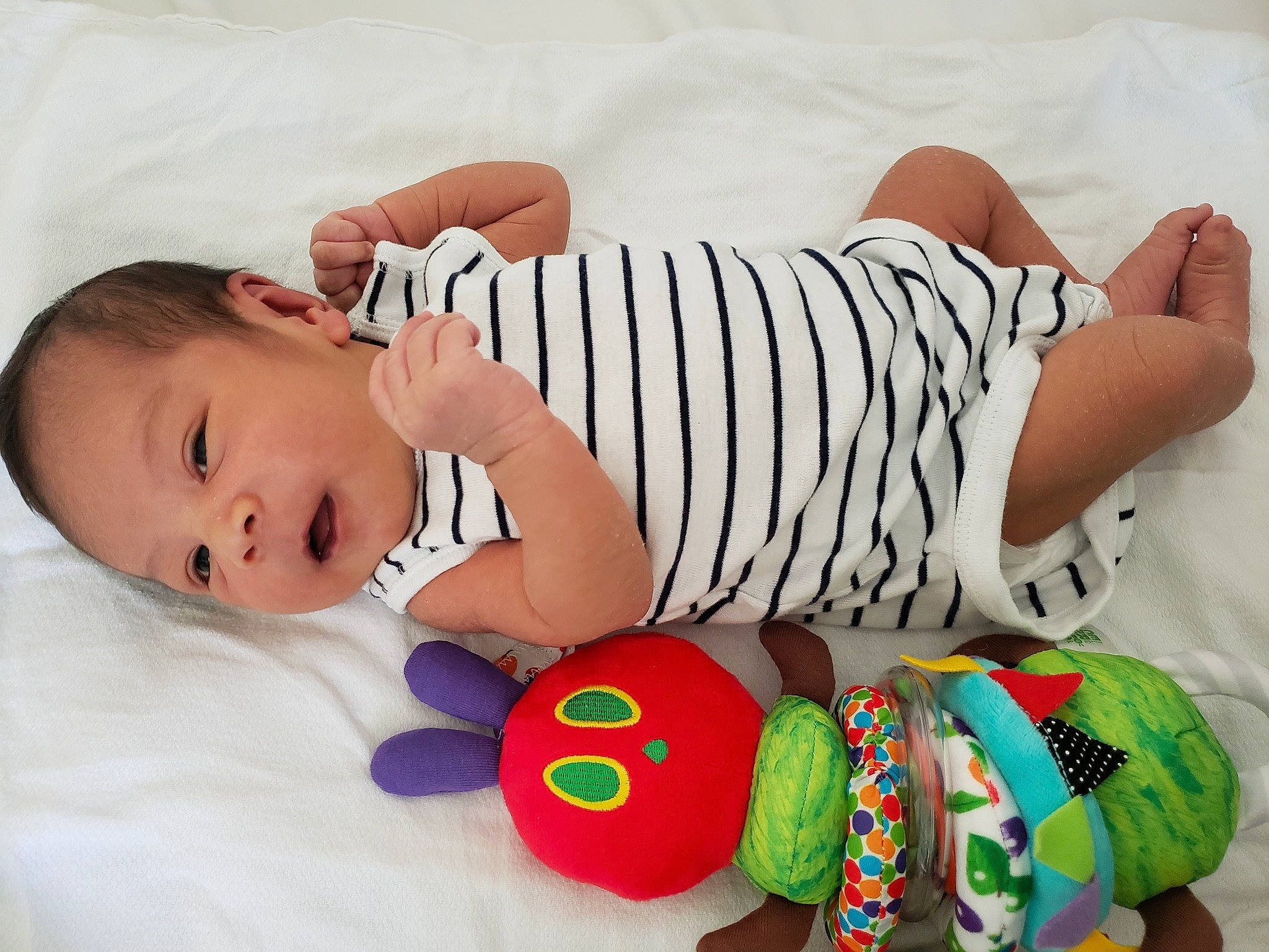 Milo joined the competition — help win amazing prizes! arm, baby, baby_products, baby_sleeping, baby_toddler_clothing, cheek, child, comfort, finger, human_body, linens, pattern, person, product, skin, sleeve, textile, thigh, toddler, white