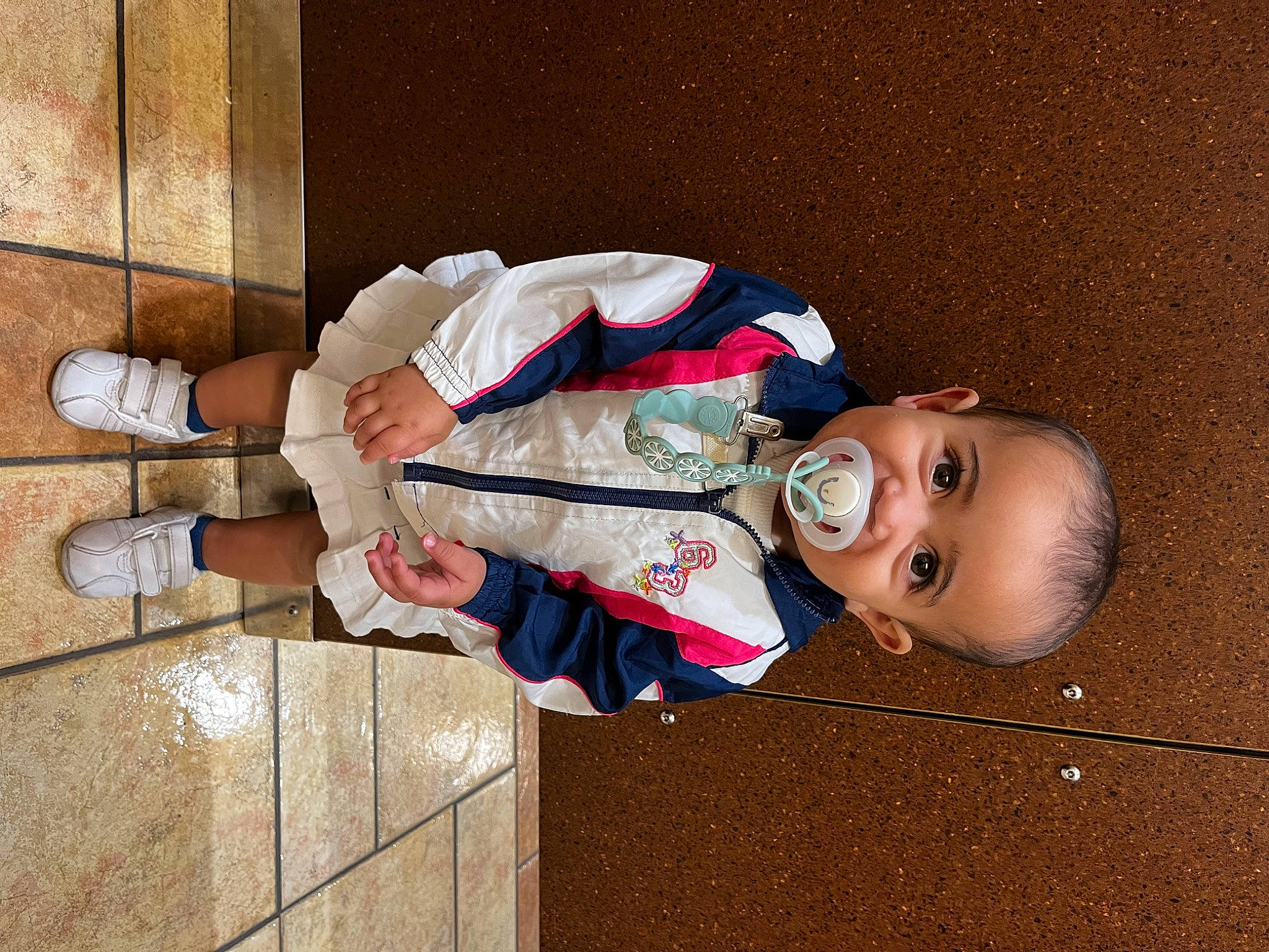 Evangeline is registered to the contest to win money with this photo: baby, baby_toddler_clothing, child, elbow, eyewear, happy, hat, human_body, human_leg, person, sitting, sleeve, toddler, wood, wrist