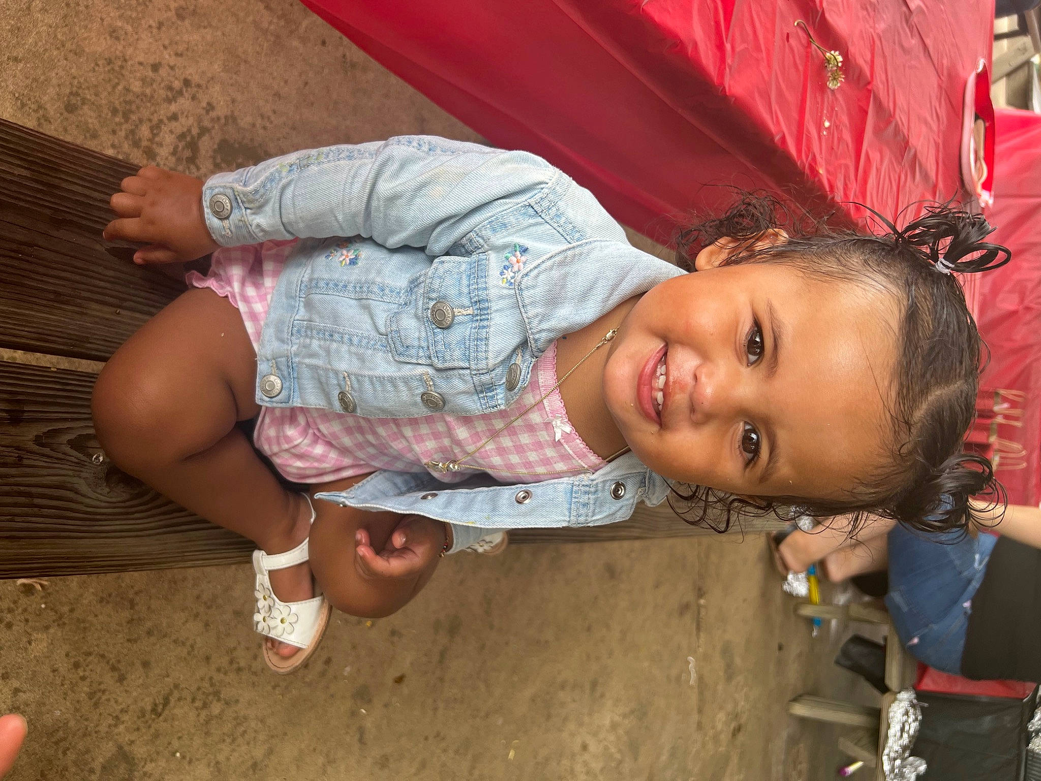 Guviannie Leeanet is registered to the contest to win money with this photo: child, facial_expression, foot, fun, grass, happy, hat, headgear, human_leg, joy, leisure, lip, mouth, person, pink, play, skin, smile, thigh, toddler