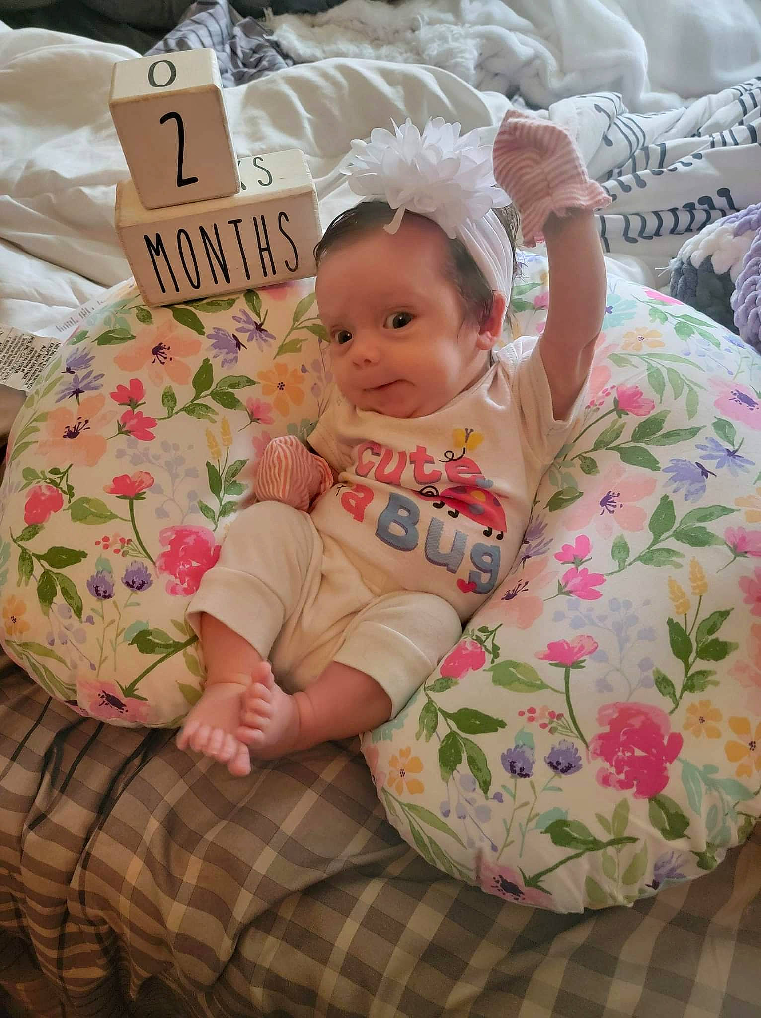 Oaklee is registered to the contest to win money with this photo: baby, baby_products, baby_safety, baby_sleeping, baby_toddler_clothing, bedding, bedtime, cheek, child, comfort, event, happy, head, linens, pattern, person, pink, sitting, skin, textile