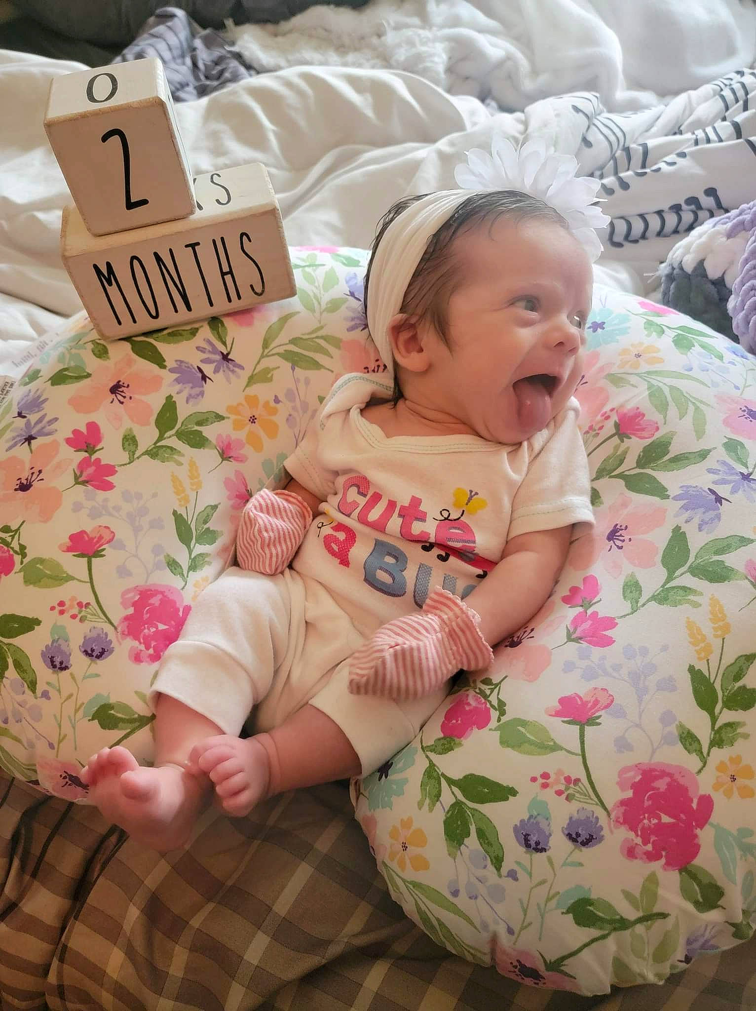 Oaklee joined the competition — help win amazing prizes! baby, baby_toddler_clothing, bed_sheet, bedding, child, comfort, event, happy, hat, linens, pattern, person, pink, room, sitting, skin, sleeve, smile, t_shirt, textile