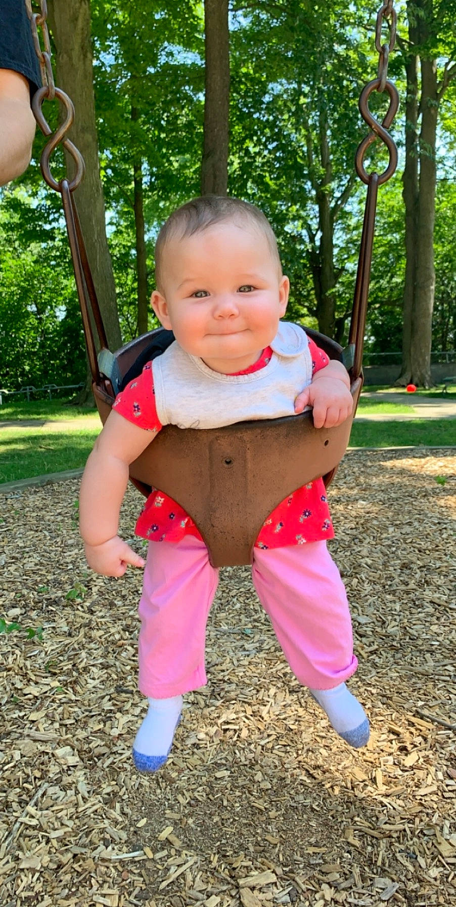 Vivianna is registered to the contest to win money with this photo: baby, baby_toddler_clothing, child, joy, outdoor_play_equipment, person, pink, play, playground, public_space, smile, swing, toddler