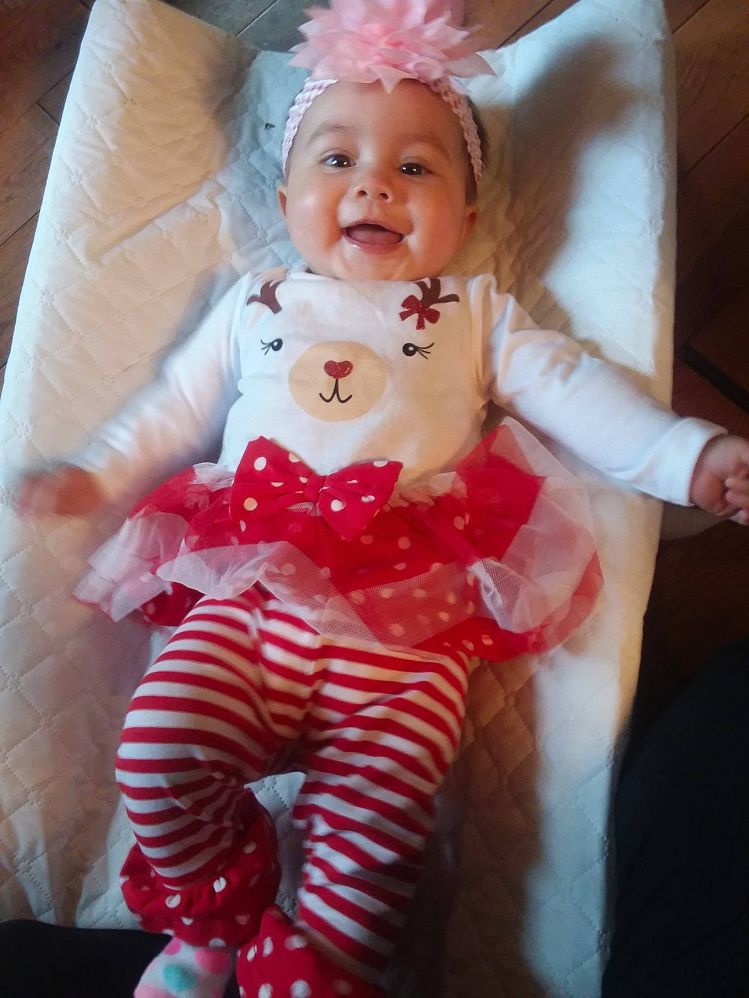 Claudia is registered to the contest to win money with this photo: baby, blond, cheek, child, christmas, doll, dress, ear, eye, face, head, iris, lip, person, pink, red, skin, smile, toddler, toy