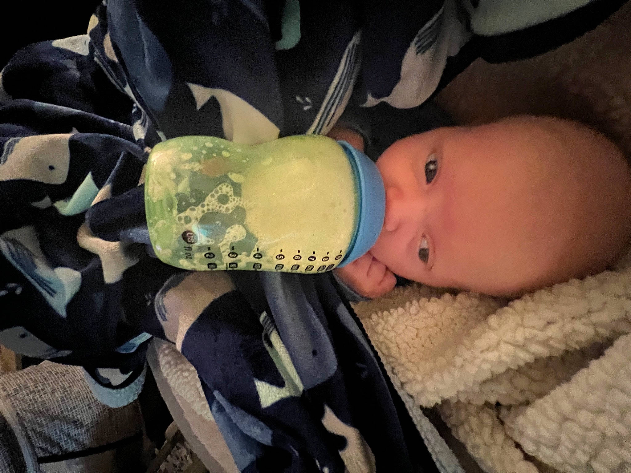 Kolten is registered to the contest to win money with this photo: baby, baby_carrier, baby_products, baby_toddler_clothing, bottle, child, comfort, drinkware, eye, eyelash, finger, hand, human_body, nail, person, personal_protective_equipment, plastic_bottle, skin, thumb, toddler