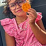Yasmine participe au concours pour gagner de l'argent avec cette photo : child, girl, glasses, pink_dress, smile, lollipop, star_shape, jewelry, necklace, car_seat, sunlight, happy, portrait, casual, summer, hair, hand, closeup, seat, cute