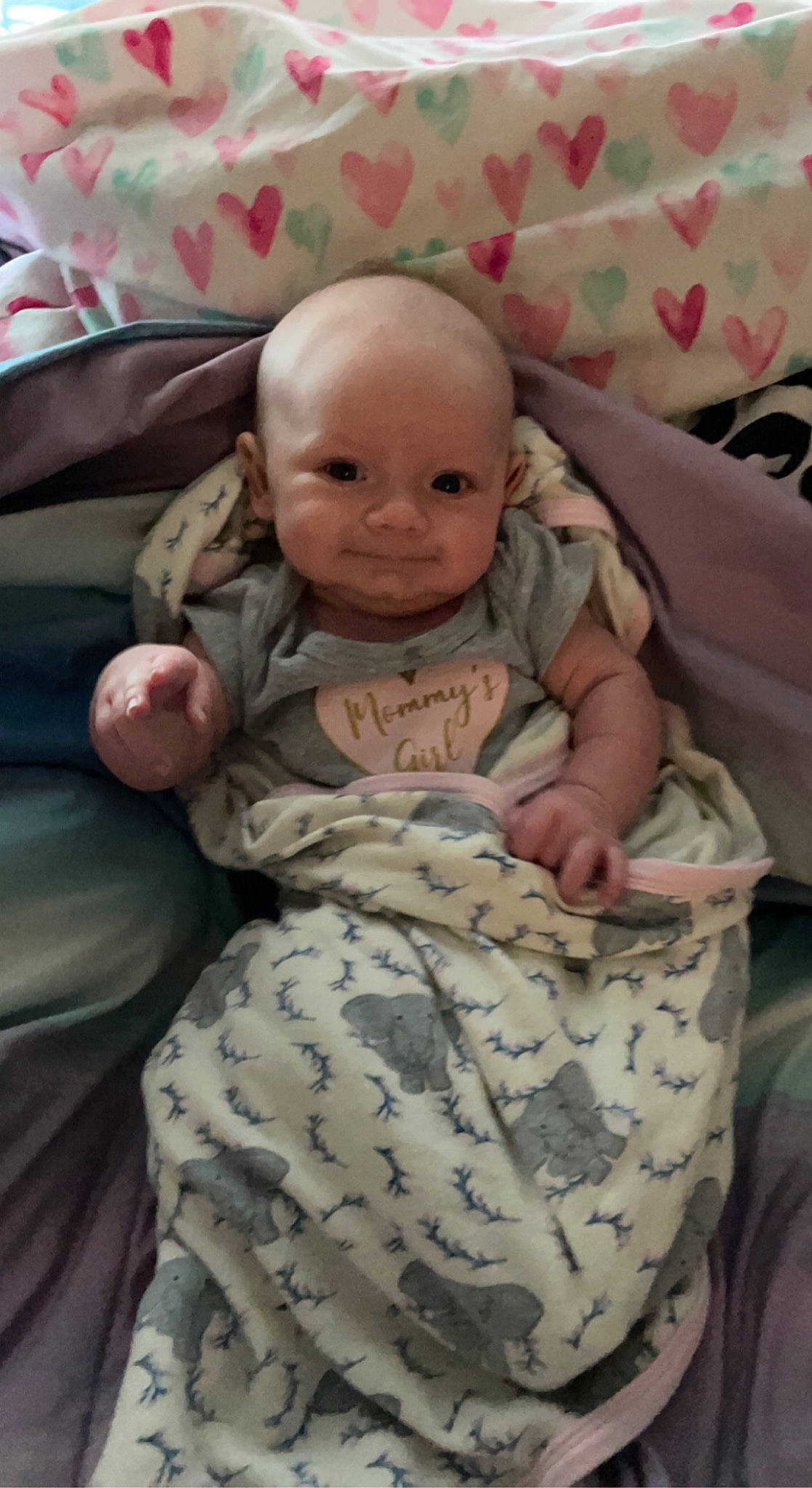 Vivian is registered to the contest to win money with this photo: baby, baby_products, baby_sleeping, baby_toddler_clothing, bedding, cheek, child, comfort, eye, face, head, infant_bed, linens, military_camouflage, mouth, person, skin, sleeve, smile, textile