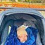 Usayd Al Malik is registered to the contest to win money with this photo: baby, infant, car_seat, blanket, hat, sleeping, pumpkin_patch, autumn, outdoor, trees, fence, grass, blue_blanket, beige_hat, face, child, nature, seasonal, peaceful, cozy