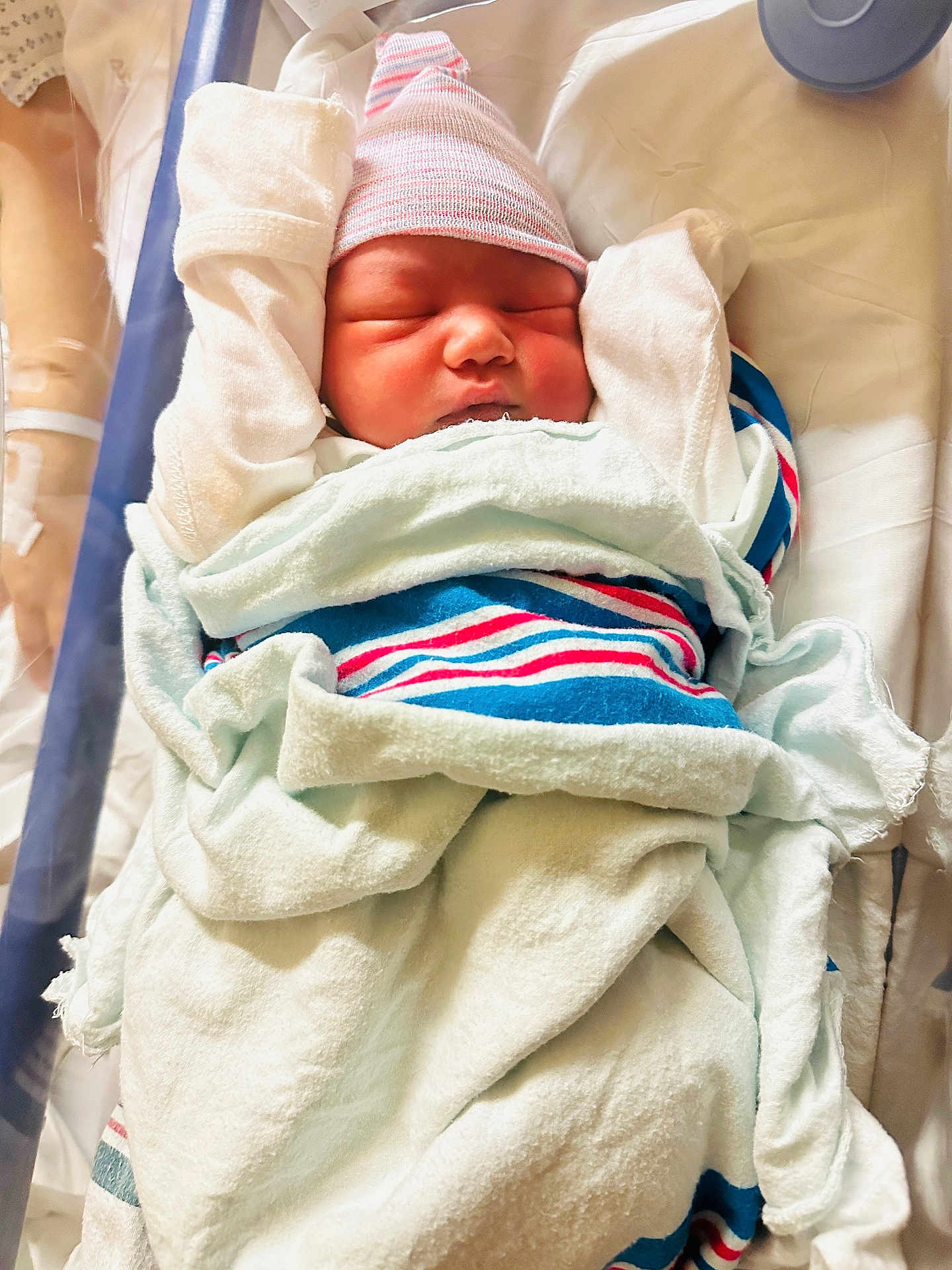 Usayd Al Malik joined the competition — help win amazing prizes! newborn, baby, infant, hospital, blanket, cap, sleeping, swaddled, soft, cute, arms_up, striped, bed, bedroom, close_up, child, person, healthcare, rest, wrapped