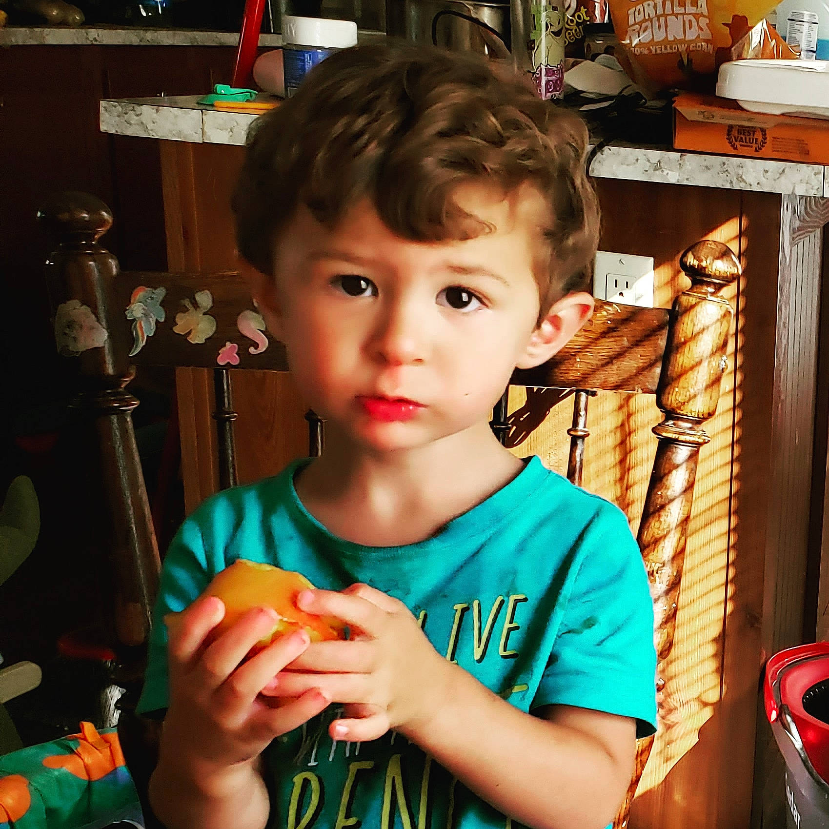 Jaxon is registered to the contest to win money with this photo: child, comfort_food, cool, ear, finger, hand, person, play, thumb, toddler