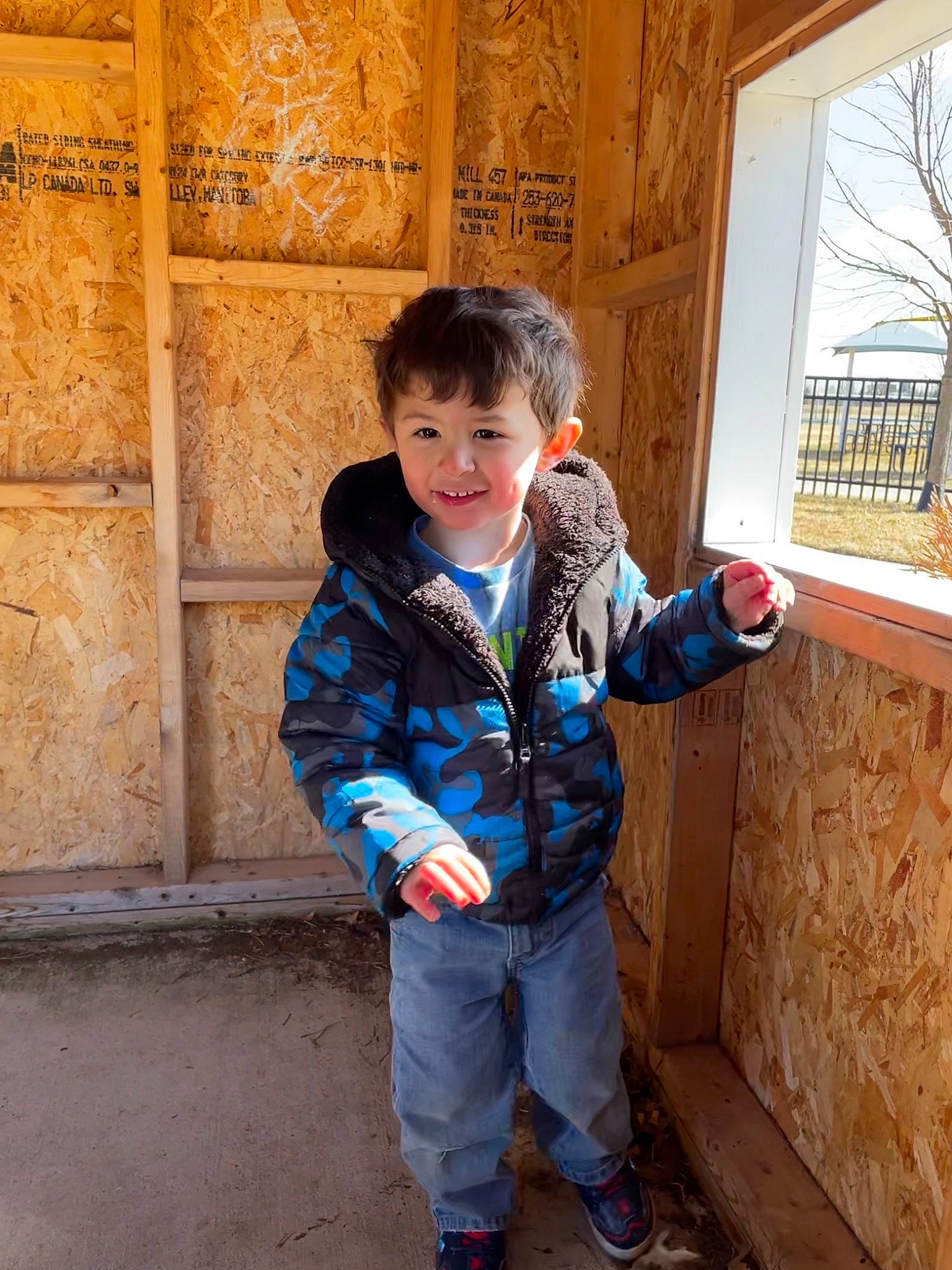 Jaxon is registered to the contest to win money with this photo: baby_toddler_clothing, child, denim, electric_blue, fun, happy, joy, leisure, person, sitting, sleeve, smile, standing, toddler, travel, tree, vacation, window, wood