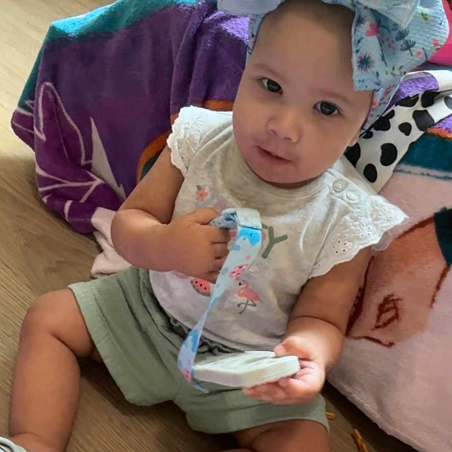 Jadyn joined the competition — help win amazing prizes! adult, baby, bonnet, clothing, couch, cushion, face, footwear, furniture, hat, head, homedecor, indoors, male, man, person, photography, portrait, shoe, sitting