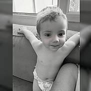 Thymaël participe au concours pour gagner de l'argent avec cette photo : toddler, child, diaper, smile, couch, indoor, window, black_and_white, happy, arms_outstretched, young_child, person, face, hair, skin, infant, baby, cute, portrait, seated