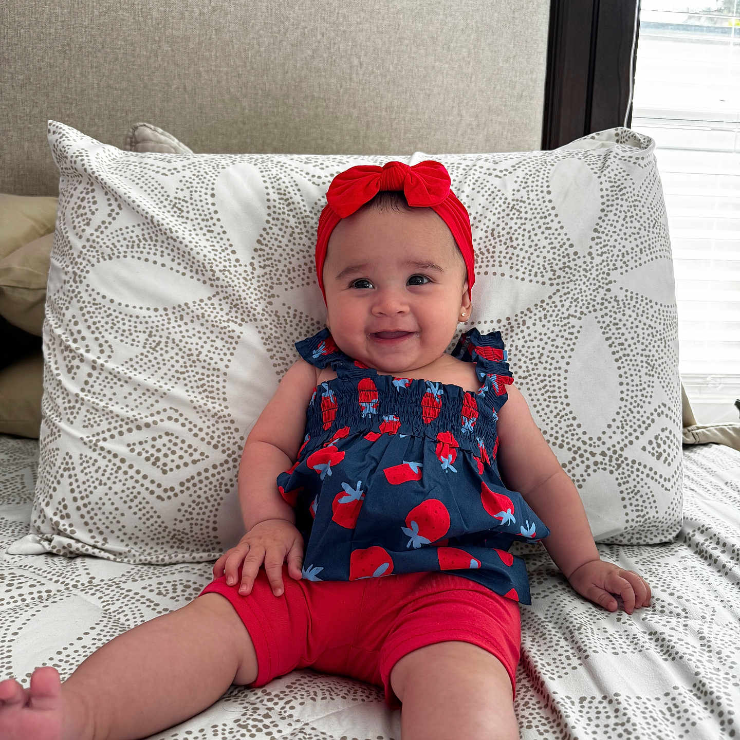 Isabella joined the competition — help win amazing prizes! baby, bed, bedroom, cap, clothing, couch, cushion, face, furniture, hat, head, homedecor, indoors, person, photography, pillow, portrait, room, shorts, sitting