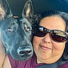 Luna is registered to the contest to win money with this photo: animal, black_dog, car_interior, casual, closeup, companion, dog, ear, friendship, fur, head, human, indoor, pet, portrait, seatbelt, selfie, smile, sunglasses, woman