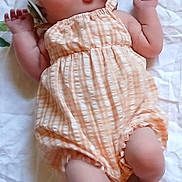 Gloria is registered to the contest to win money with this photo: baby, sleeping, infant, romper, orange, blanket, peaceful, child, newborn, cute, soft, skin, hand, foot, laying, indoors, portrait, rest, nap, calm