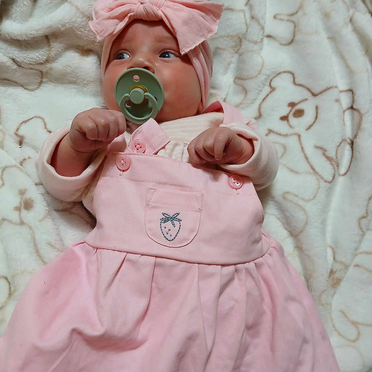 Gloria is registered to the contest to win money with this photo: baby, baby_girl, blanket, child, clothing, cozy, cute, face, headband, indoors, infant, lying_down, newborn, pacifier, pink_dress, portrait, sleepwear, small_hands, soft_texture, teddy_bear_pattern