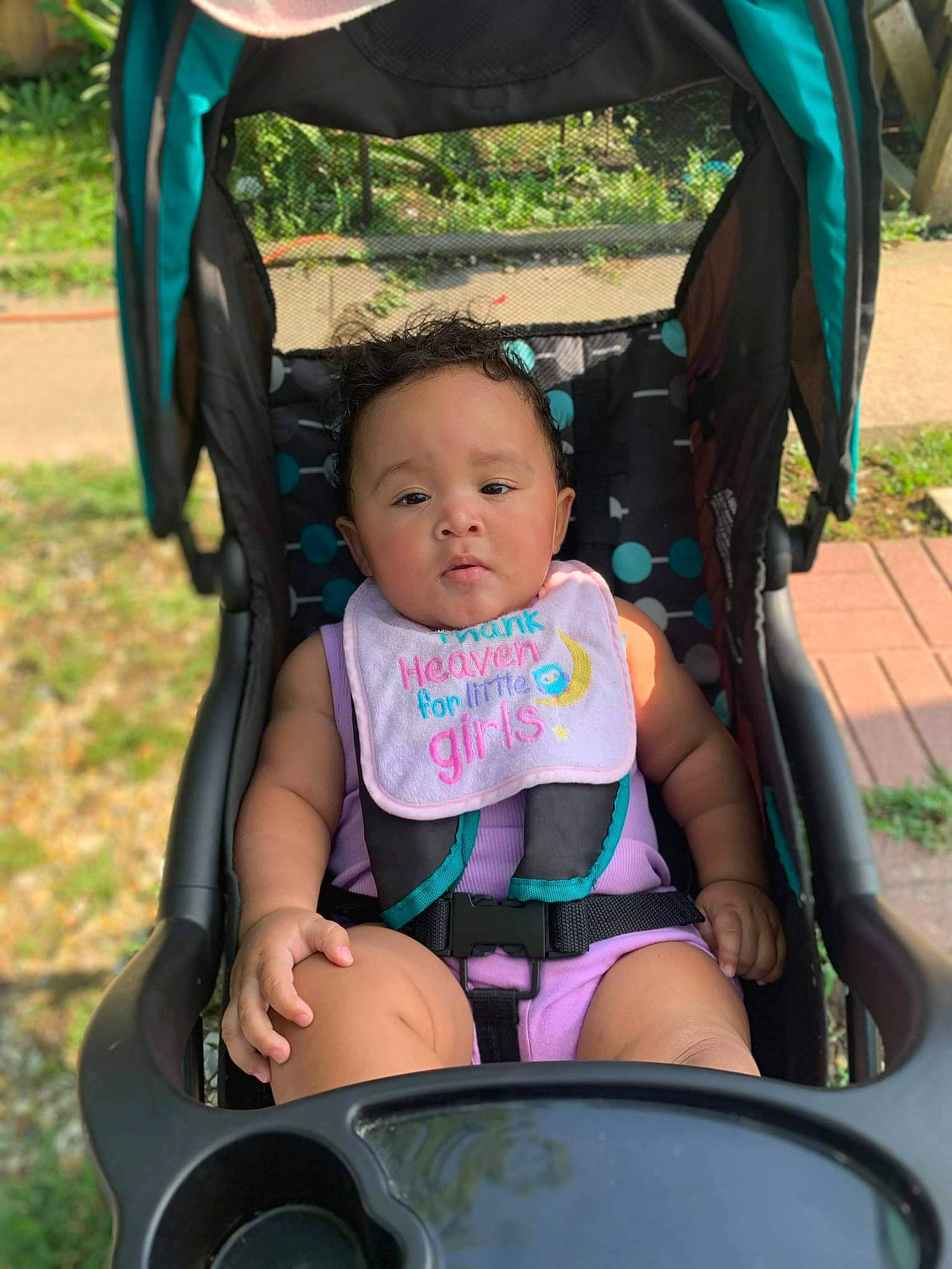 Loyalty is registered to the contest to win money with this photo: baby, baby_carriage, baby_toddler_clothing, black, blue, child, eye, fun, grass, green, happy, leisure, light, person, photograph, public_space, skin, snapshot, summer, toddler