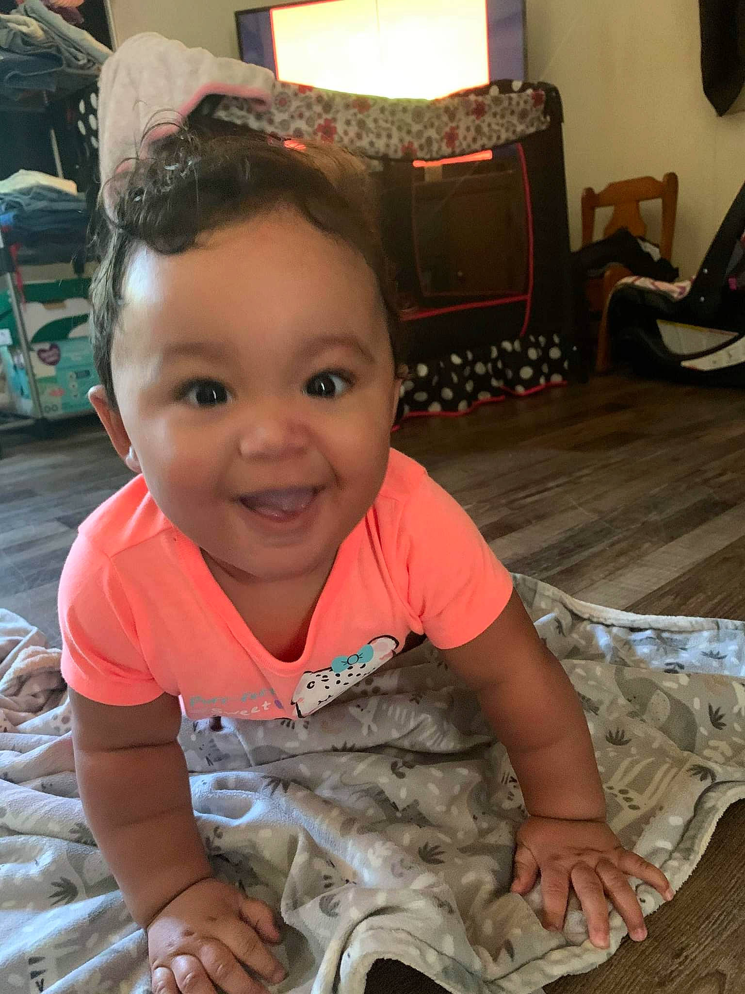 Loyalty is registered to the contest to win money with this photo: baby, baby_toddler_clothing, cheek, child, comfort, floor, flooring, fun, happy, hardwood, home_appliance, iris, joy, people, person, sitting, skin, smile, t_shirt, toddler