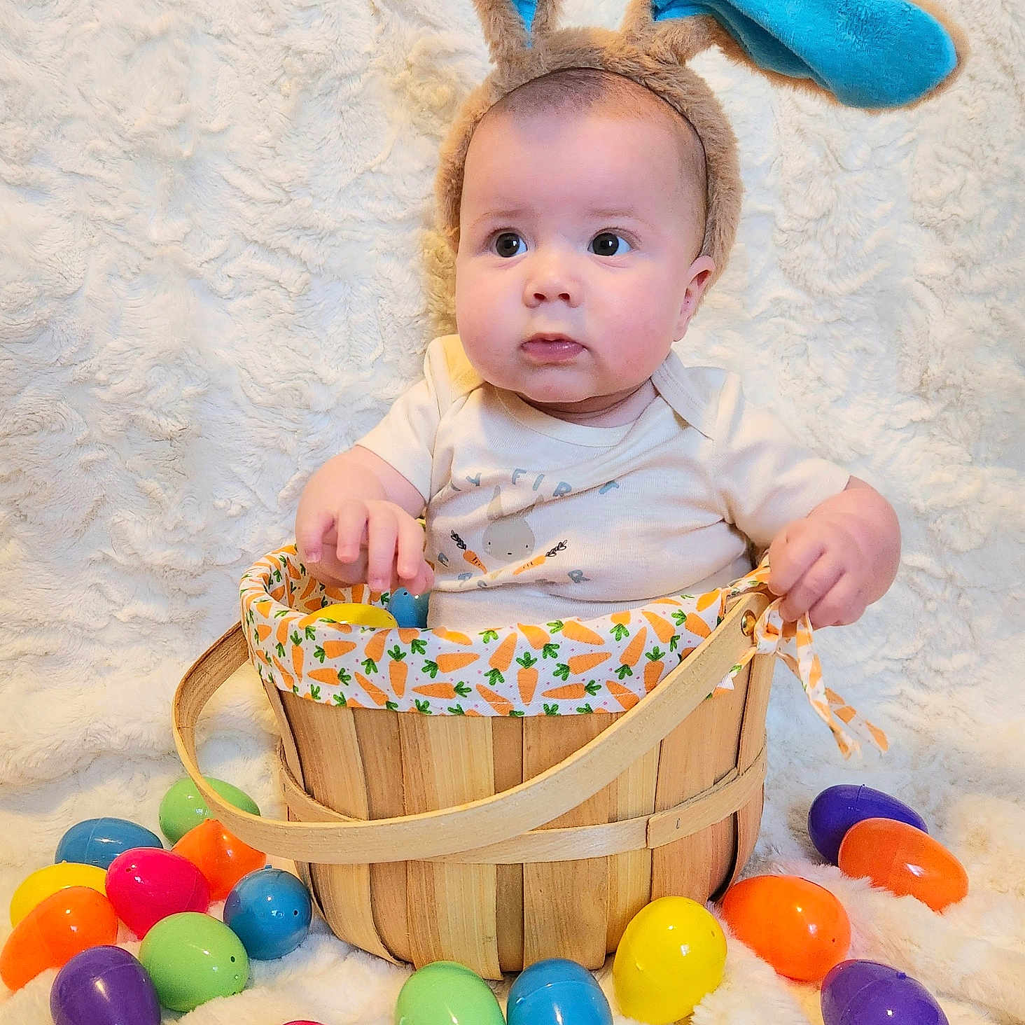 Logan joined the competition — help win amazing prizes! baby, balloon, basket, bed, bodypart, candy, egg, face, finger, food, fun, furniture, hand, head, newborn, person, photography, portrait, purple, sweets