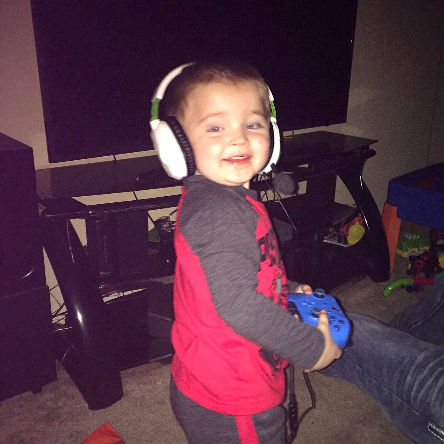 Izaiah is registered to the contest to win money with this photo: cheek, child, cool, electronic_device, face, fun, gadget, head, joint, joy, party, person, play, shoulder, skin, smile, standing, t_shirt, technology, toddler
