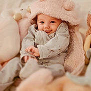 Artemis is registered to the contest to win money with this photo: baby, bed, blanket, child, comfort, cozy, cuddle, cute, doll, hat, indoors, infant, mermaid_doll, pastel_colors, plush_toy, portrait, sleepwear, smile, soft_toy, young_child