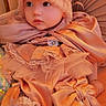 Artemis is registered to the contest to win money with this photo: baby, bow, chair, child, costume, cushion, cute, dress, fabric, face, headwear, indoors, lace, person, portrait, sitting, soft_lighting, textile, vintage_clothing, warm_color