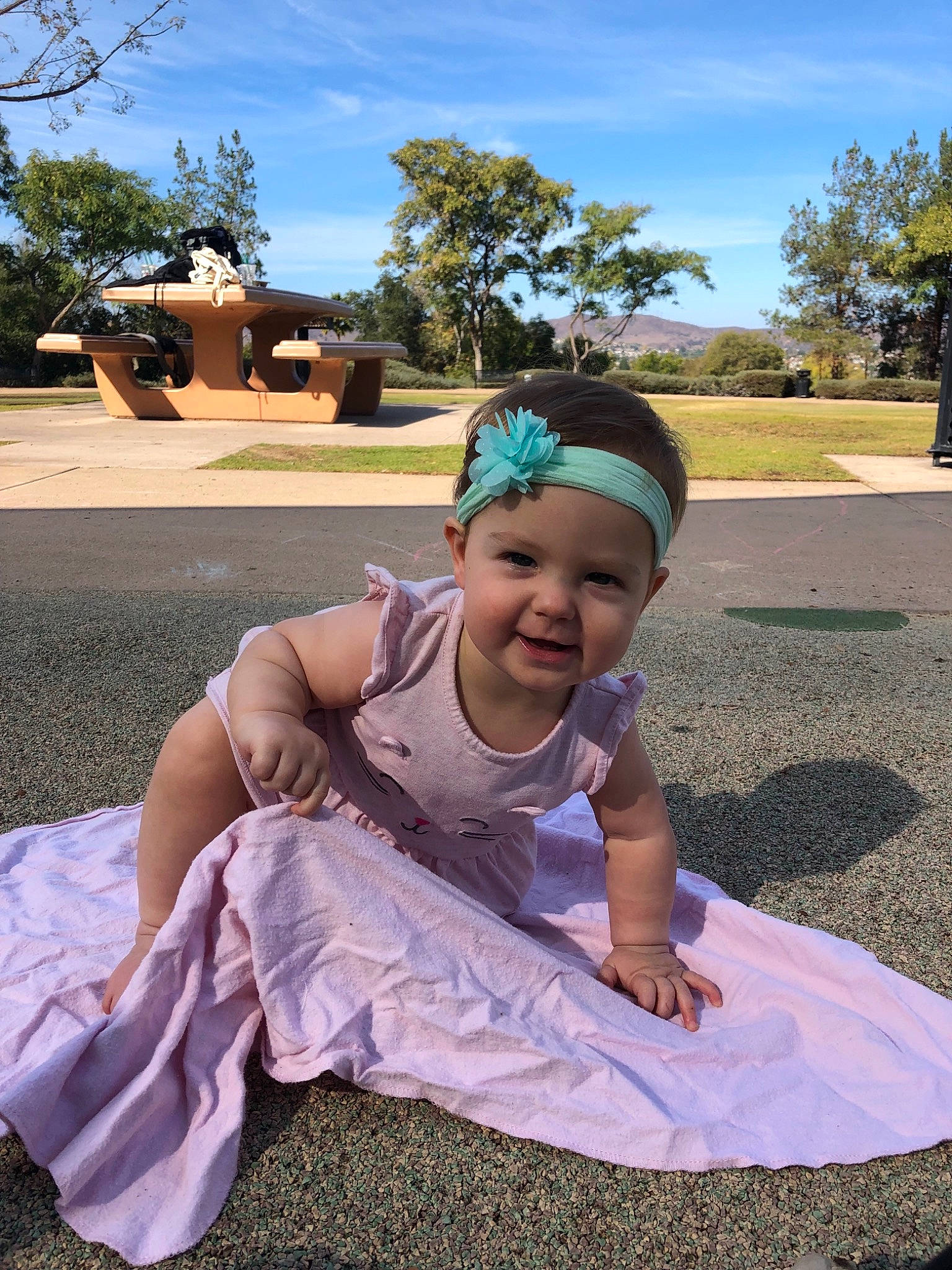 Scarlette is registered to the contest to win money with this photo: child, fun, girl, grass, headgear, headwear, leisure, person, plant, play, recreation, sand, sitting, smile, tree, vacation, vertebrate