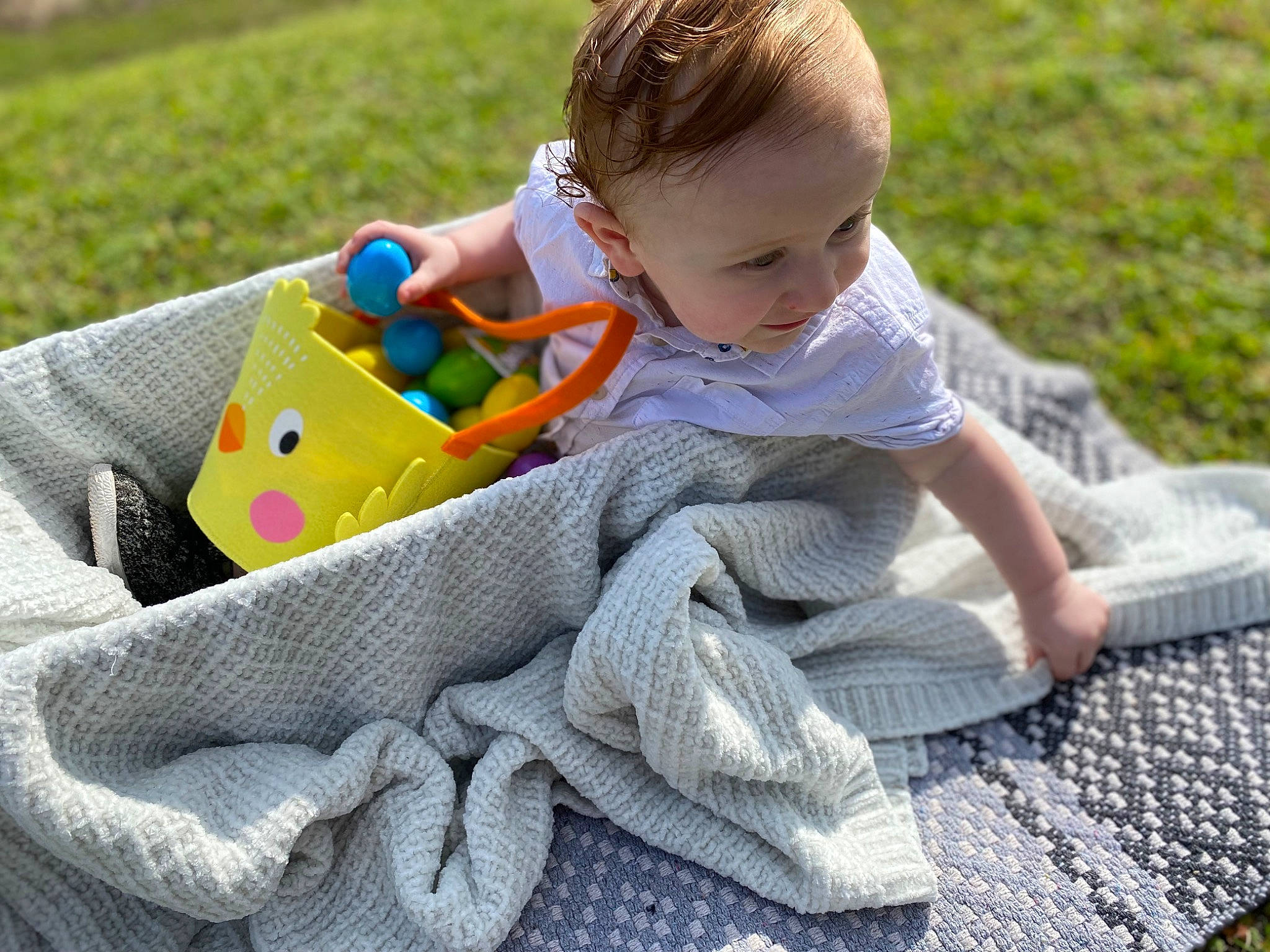 Aydan is registered to the contest to win money with this photo: baby, baby_playing_with_toys, baby_products, baby_toddler_clothing, baby_toys, child, comfort, flooring, fun, grass, happy, leisure, linens, pattern, people_in_nature, person, play, recreation, sitting, toddler