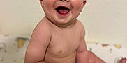 Weston joined the competition — help win amazing prizes! baby, background, bare_chest, cheeks, child, cute, expression, face, foot, green_shorts, hand, happy, indoors, infant, pattern, person, sitting, skin, smiling, young