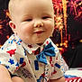 Weston joined the competition — help win amazing prizes! baby, background, blue, bow_tie, celebration, child, clothing, cute, face, festive, fireworks, happy, holiday, infant, portrait, red, shirt, sitting, smiling, white