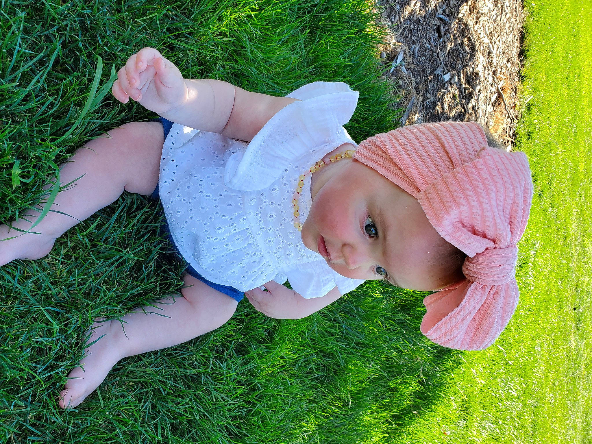 Pearl is registered to the contest to win money with this photo: baby, baby_toddler_clothing, child, fun, garden, grass, grassland, happy, hat, headwear, human_body, lawn, leisure, meadow, people_in_nature, person, plant, skin, sun_hat, toddler