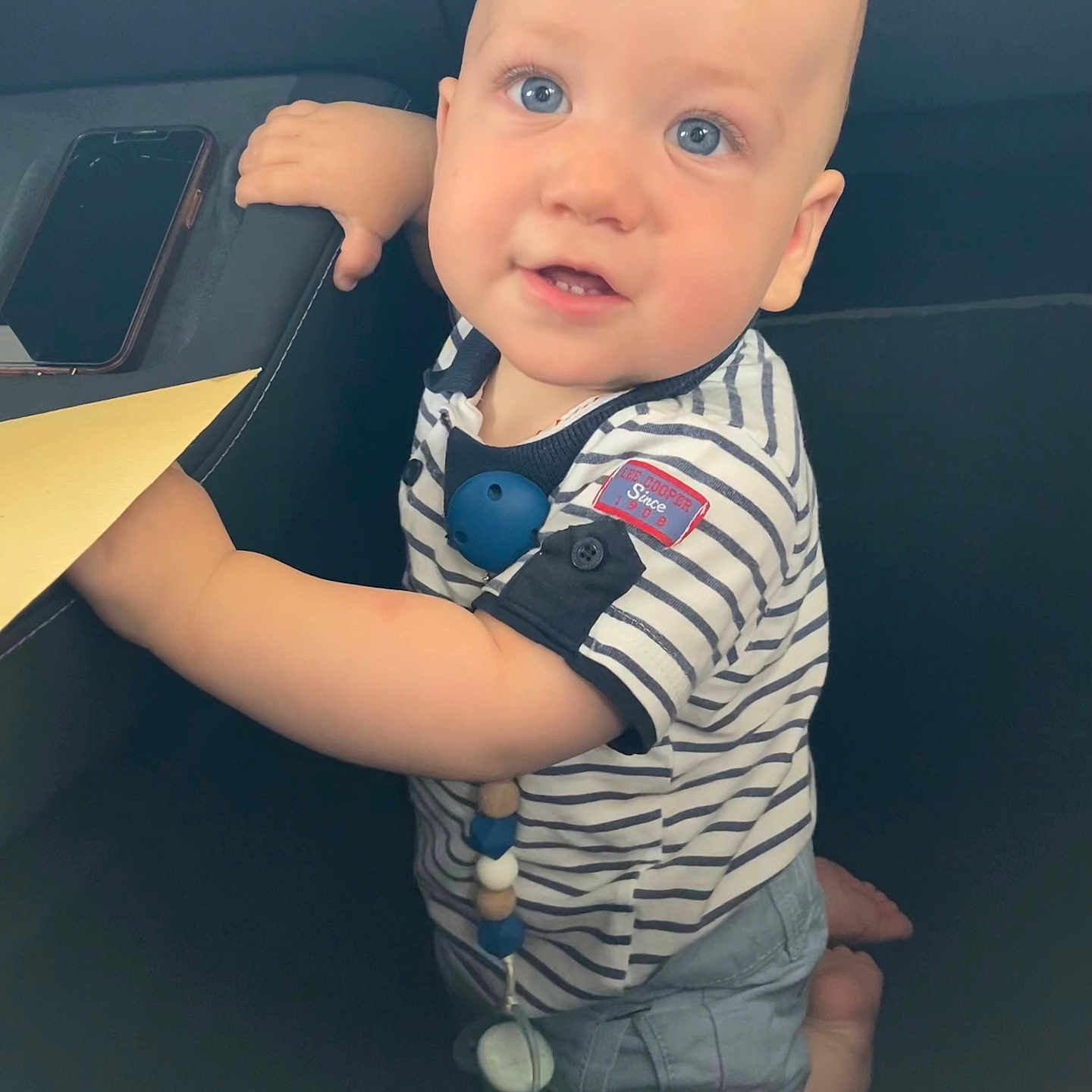 Raphael a rejoint le concours — aidez-le/la à gagner de superbes lots ! accessories, baby, belt, bracelet, clothing, electronics, face, happy, head, homedecor, mobilephone, pants, person, phone, photography, portrait, shirt, sitting, smile, t_shirt