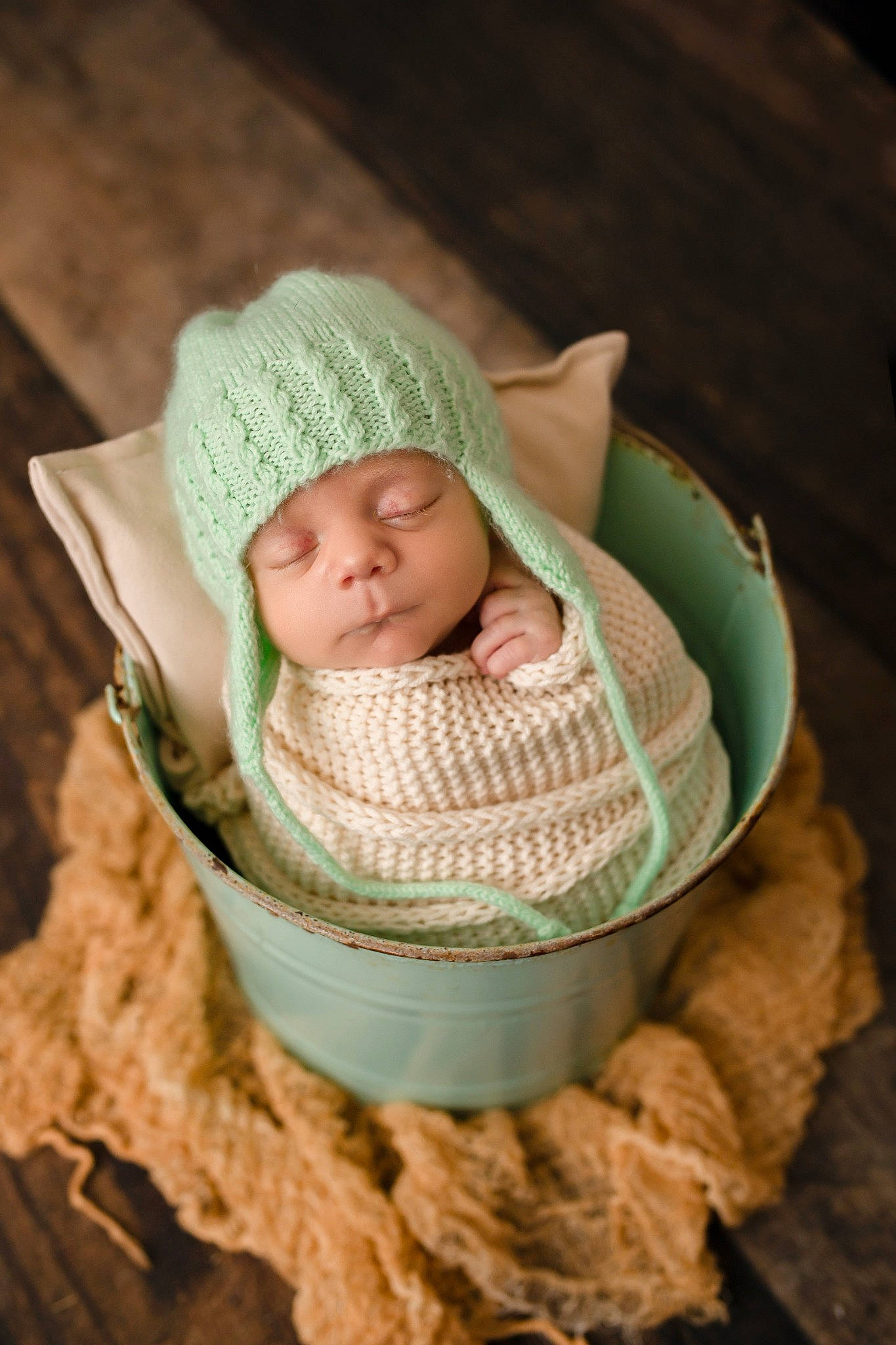 Caysen is registered to the contest to win money with this photo: baby, baby_products, baby_sleeping, baby_toddler_clothing, basket, cap, cheek, child, comfort, crochet, fashion_accessory, headgear, headwear, knit_cap, linens, outerwear, person, sitting, toddler, wood