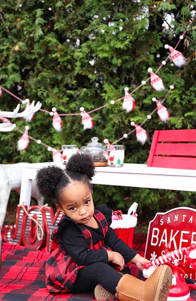 Kehlani is registered to the contest to win money with this photo: beauty, christmas, christmas_ornament, event, grass, happy, holiday, leisure, mammal, person, pink, plant, public_space, recreation, red, sitting, snapshot, summer, toddler, tree