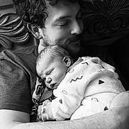 Jack joined the competition — help win amazing prizes! man, baby, newborn, sleeping, blanket, cuddle, black_and_white, portrait, love, father, child, cozy, indoor, gentle, affection, wooden_background, beard, curly_hair, rest, tenderness