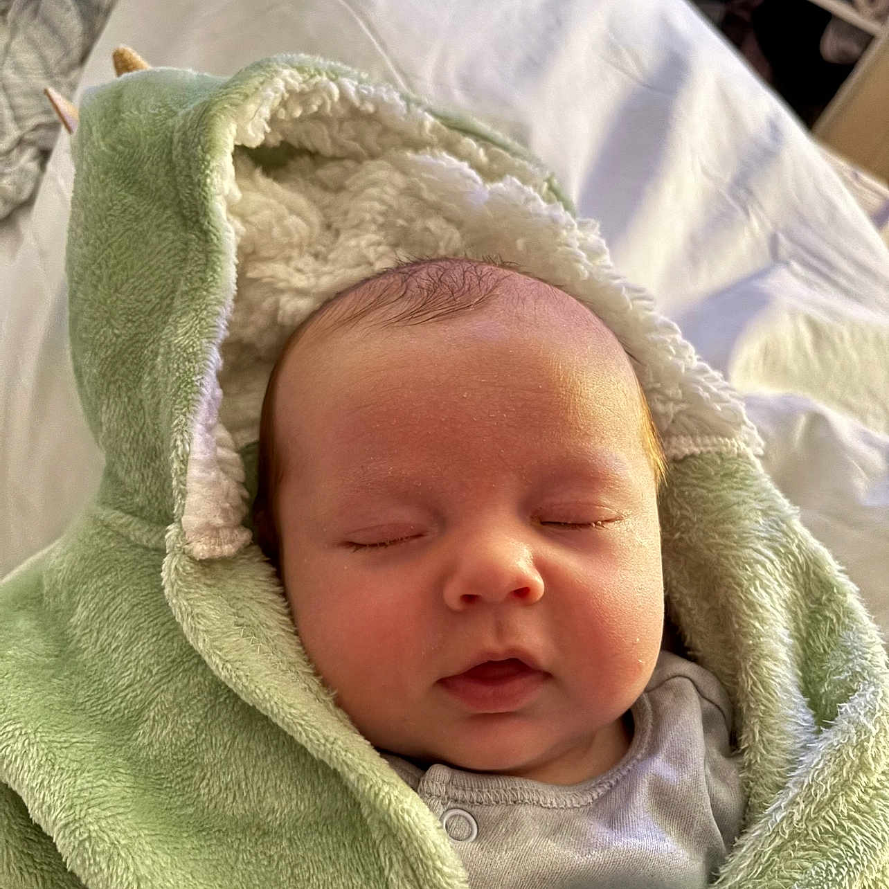 Colby joined the competition — help win amazing prizes! baby, blanket, child, clothing, cozy, cute, cute_baby, face, green, hooded_blanket, indoors, infant, newborn, peaceful, portrait, resting, sleeping, soft_texture, toddler, warm