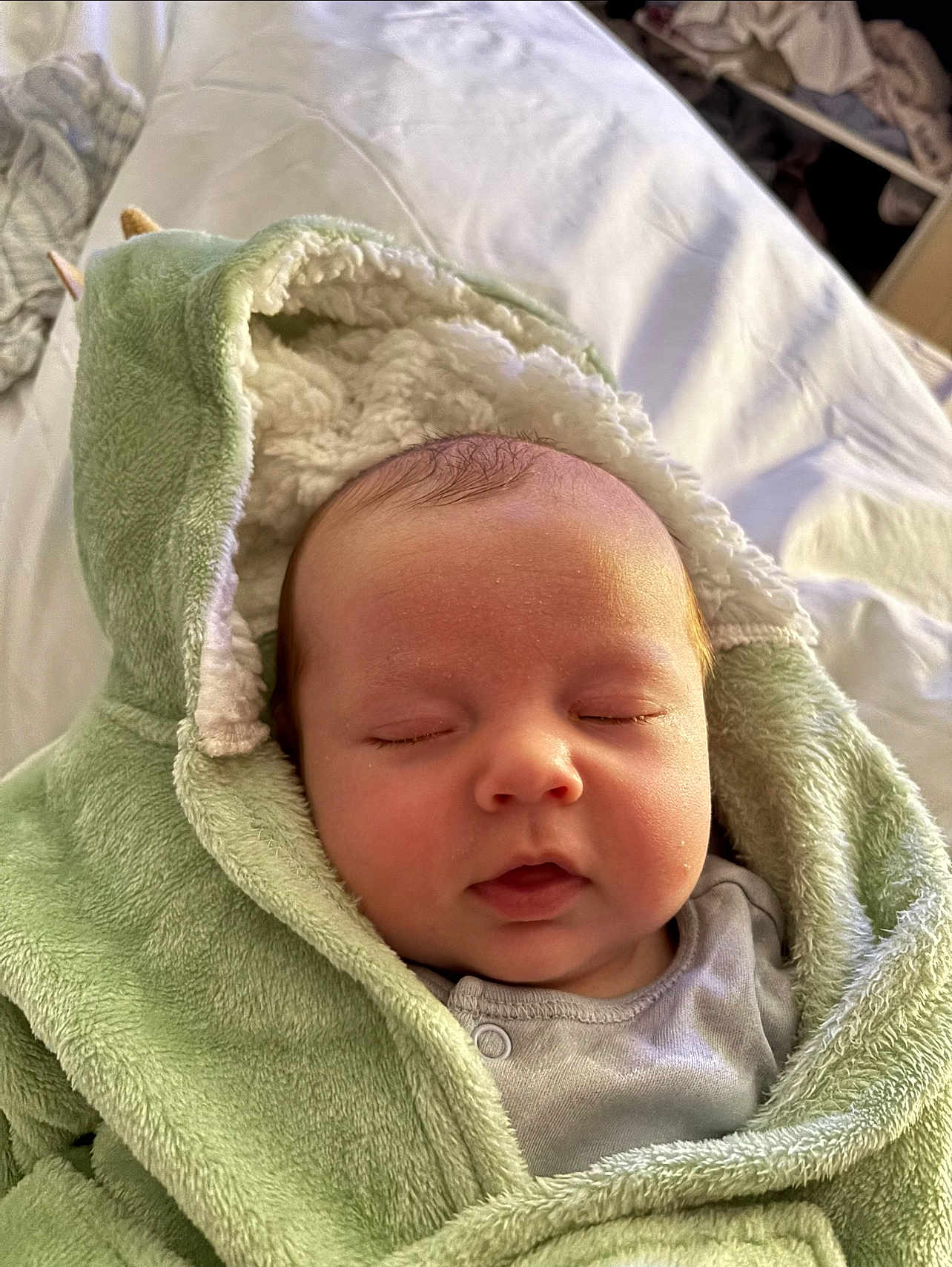 Colby joined the competition — help win amazing prizes! baby, sleeping, blanket, hooded_blanket, green, soft_texture, infant, face, peaceful, cozy, cute, child, newborn, indoors, portrait, cute_baby, resting, toddler, clothing, warm
