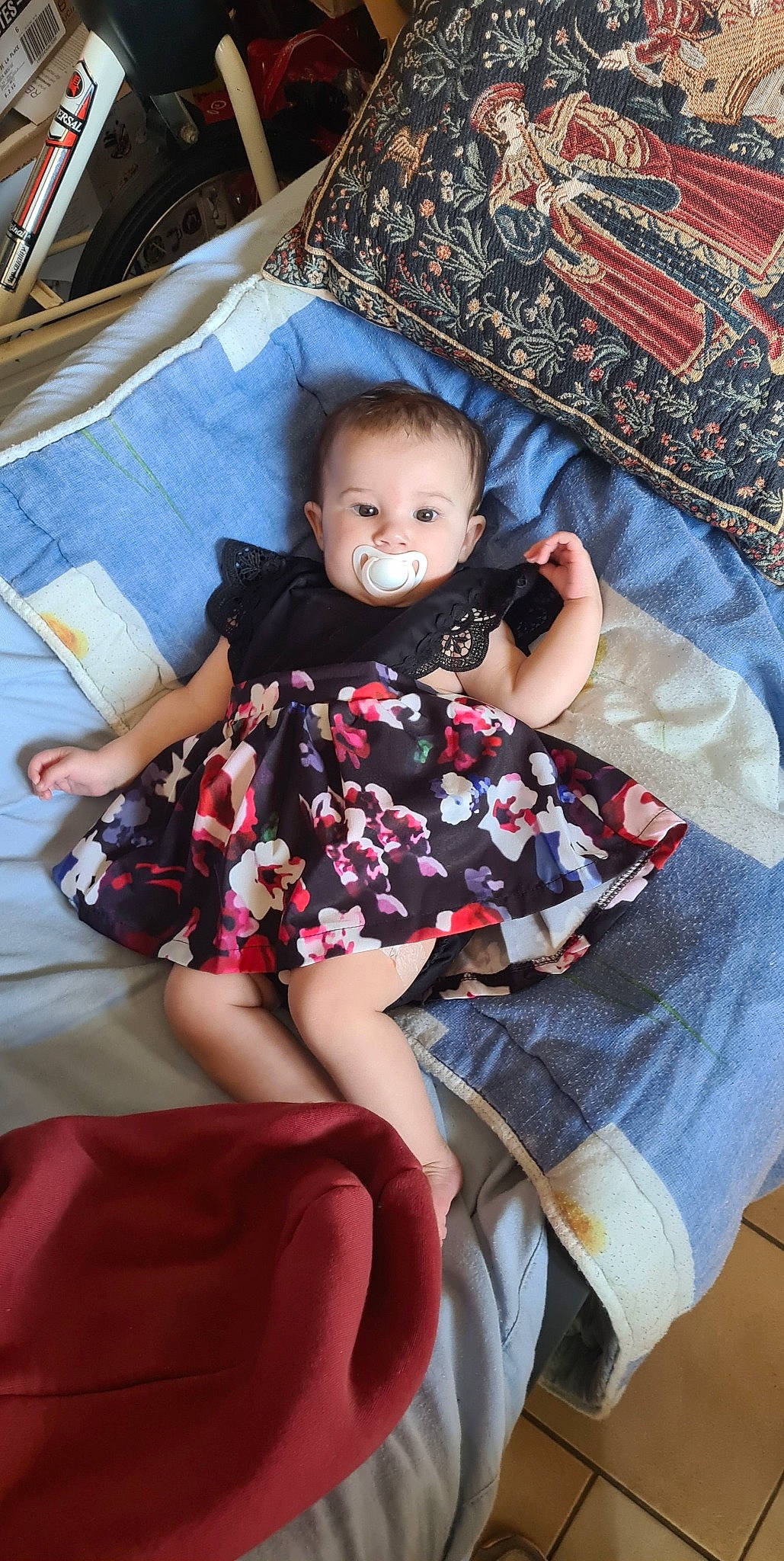 Lexie participe au concours pour gagner de l'argent avec cette photo : baby, baby_toddler_clothing, child, comfort, couch, face, fun, human_leg, knee, lap, linens, magenta, pattern, person, pink, purple, sitting, skin, sock, thigh