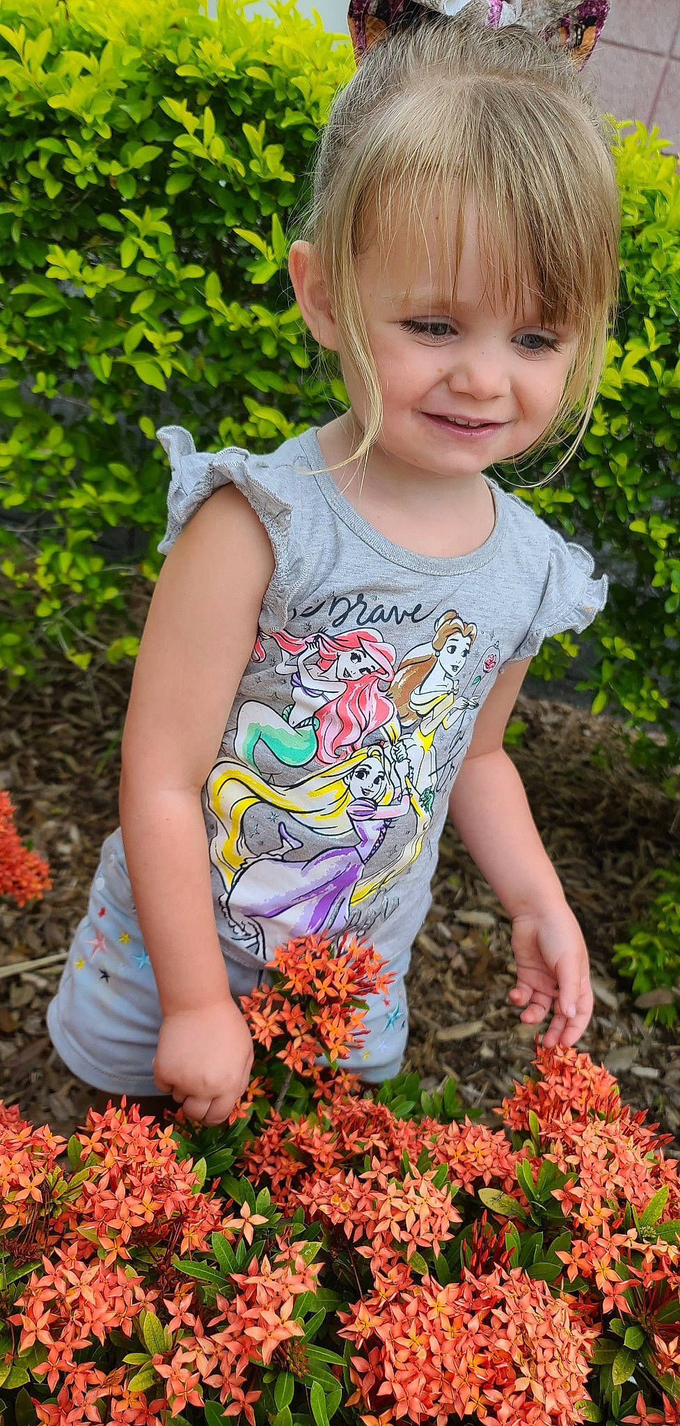 Evah is registered to the contest to win money with this photo: baby_toddler_clothing, beauty, child, dress, face, flower, grass, groundcover, happy, joy, orange, people_in_nature, person, petal, photograph, pink, plant, smile, summer, t_shirt